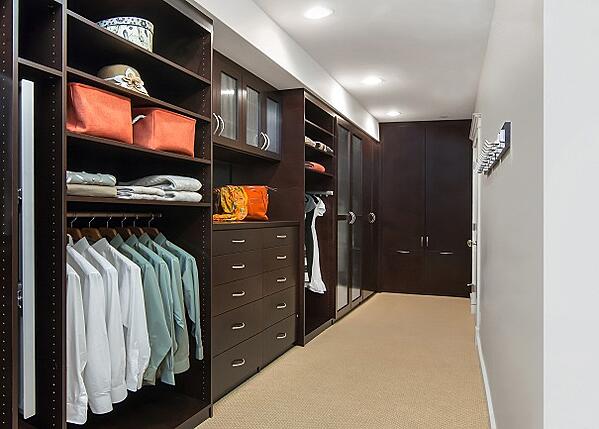 Deluxe Walk-in Closet by Valet Custom Cabinets & Closets